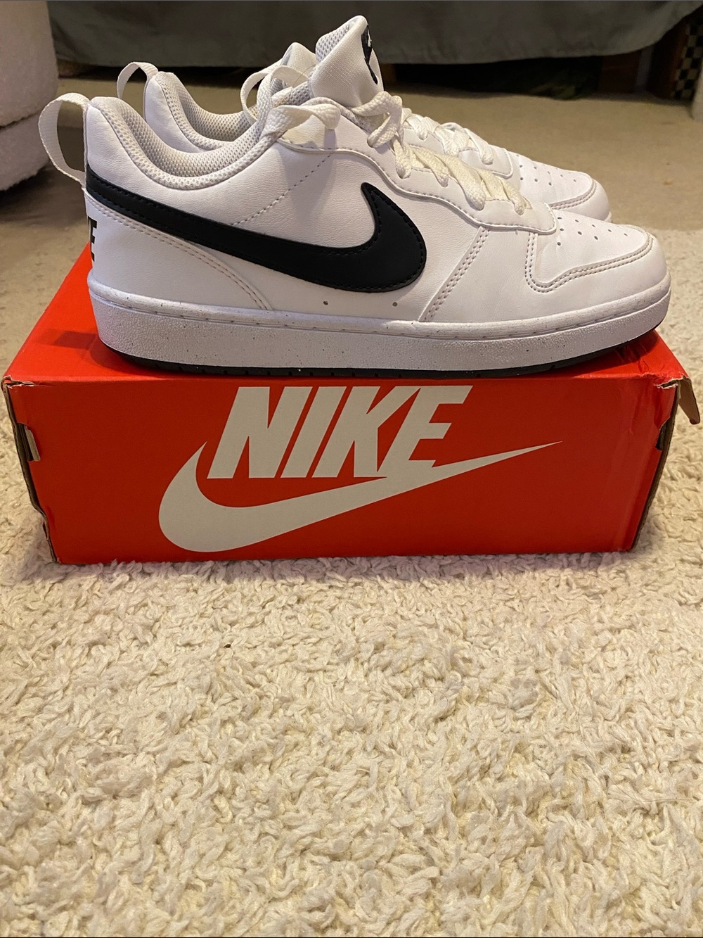 Nike Kids White Sneakers with Black Swoosh